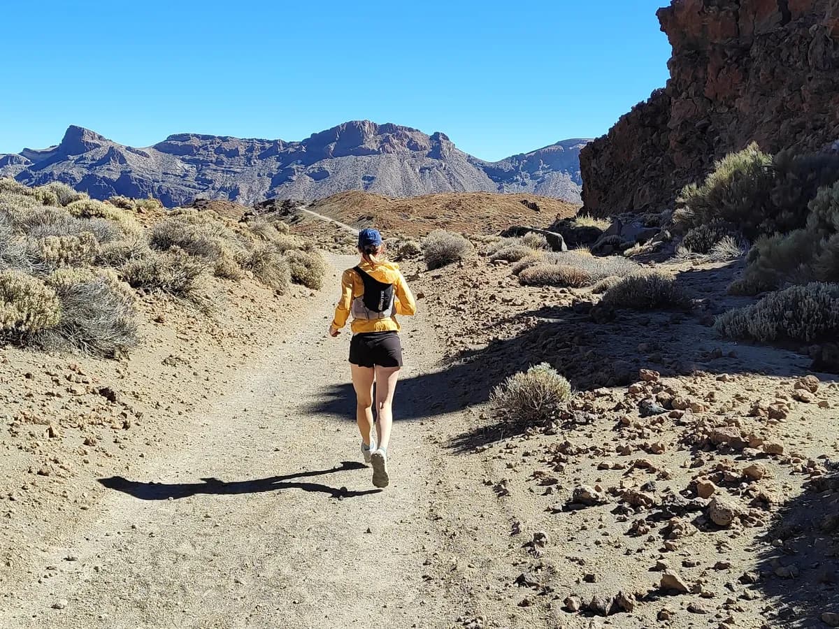Runner on a volcanic desert trail in Tenerife