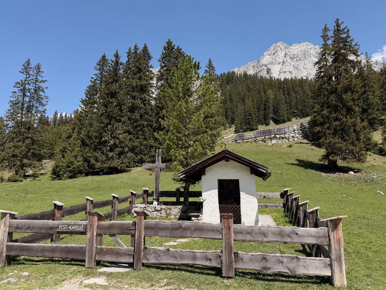 Historic Pestkapelle chapel near Ehrwalder Alm with alpine meadows and views toward Gatterl, ZUT 107K.